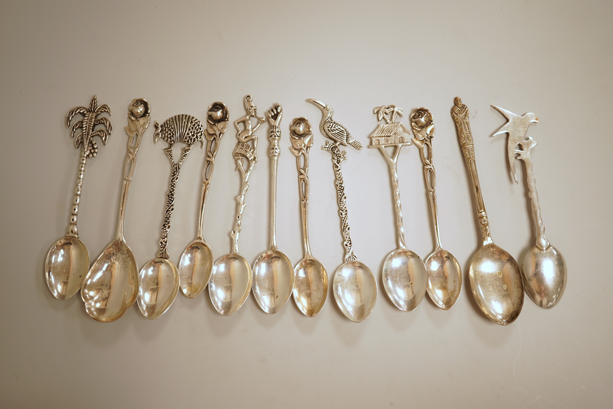A pierced 800 standard white metal fruit bowl, diameter 23.6cm, a silver mounted hand mirror and two brushes, a 19th century continental white metal pyx, a pair of George V silver mounted whisky noggins, Birmingham, 1925